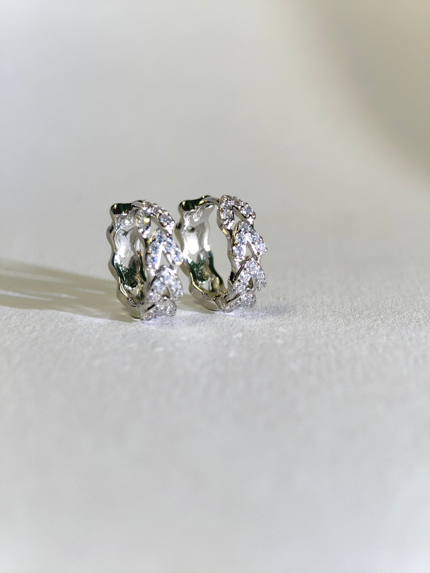 Rohari - Silver Tone Braided Huggie Hoop Earrings